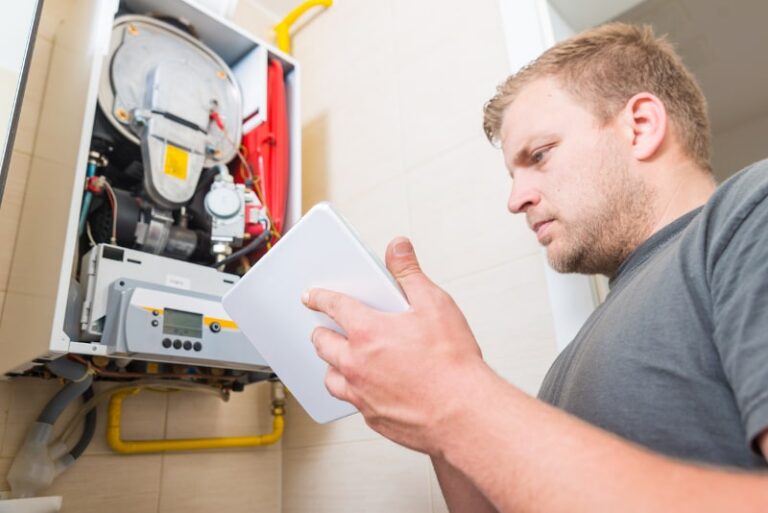 A technician repairing a gas furnace.